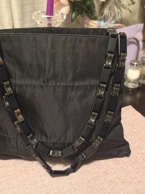 Vintage Prada Tessuto black nylon triangle logo shoulder bag.